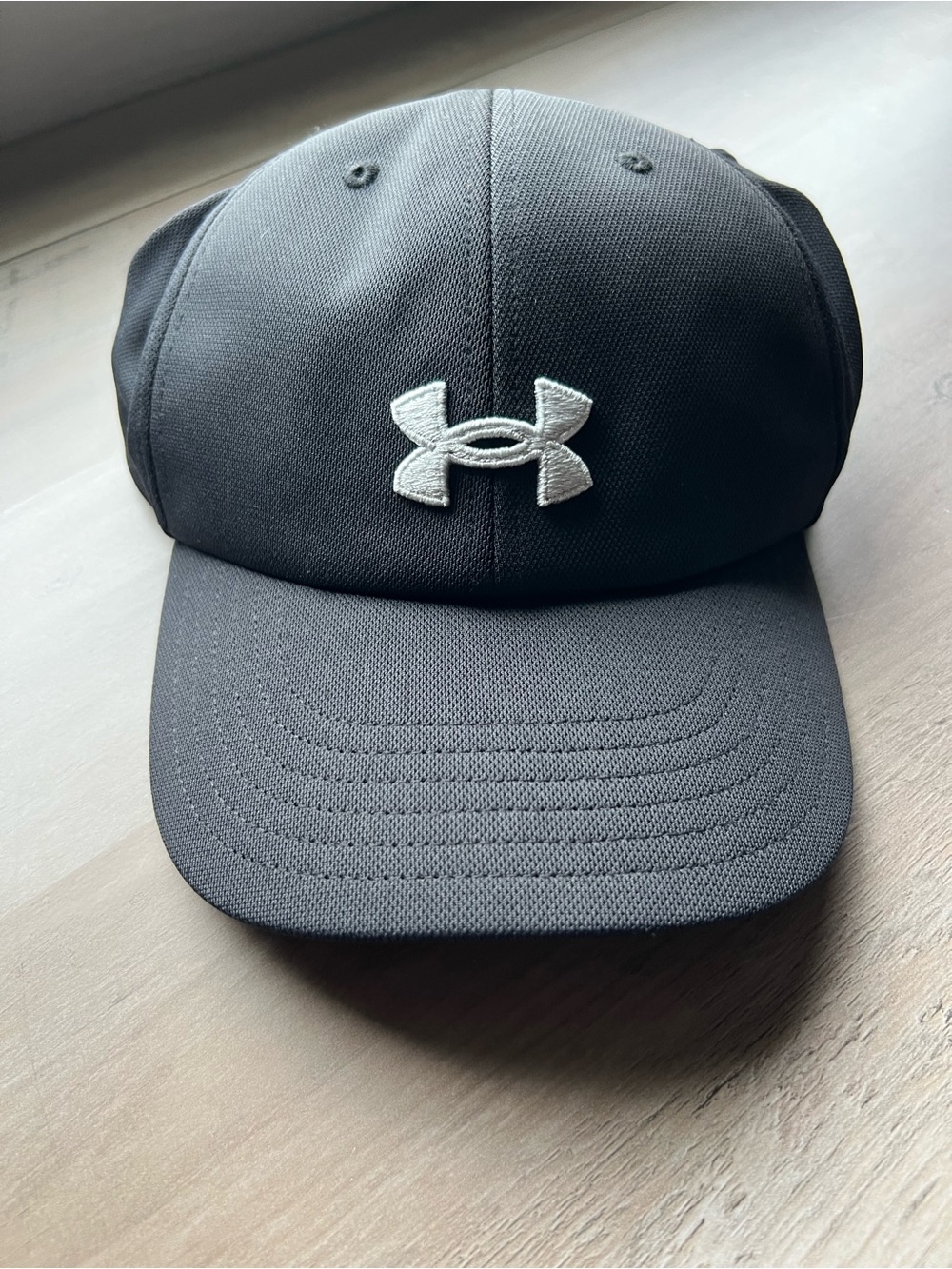 Ladies Under Armour Ponytail Black Cap with White Embroidered Logo